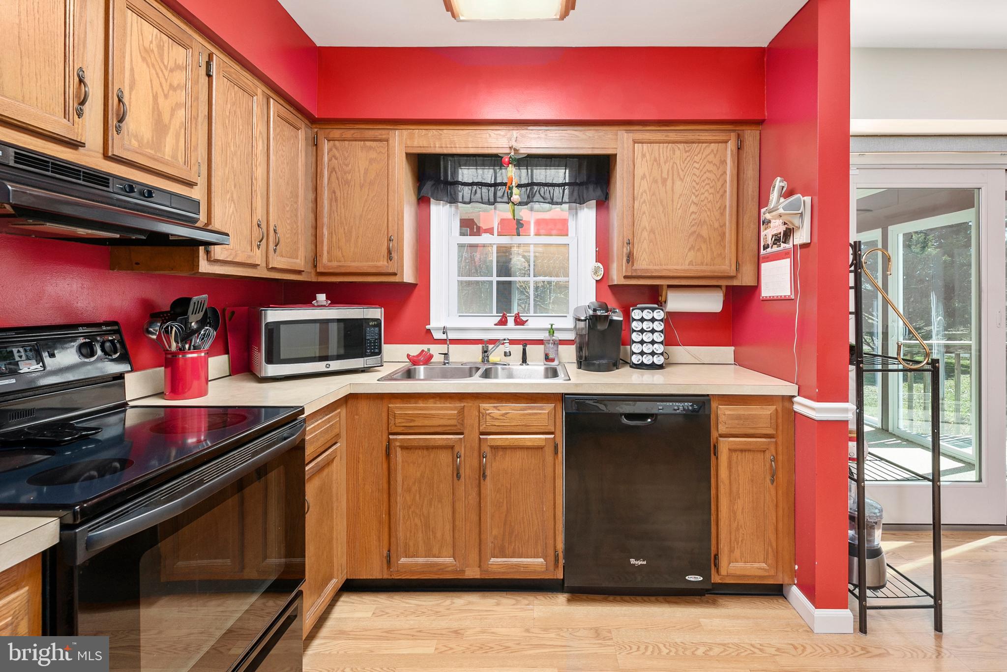 754 Oldfield Point Road Elkton, MD 21921 - Photo 18 of 49 a kitchen with stainless steel appliances a sink stove and cabinets