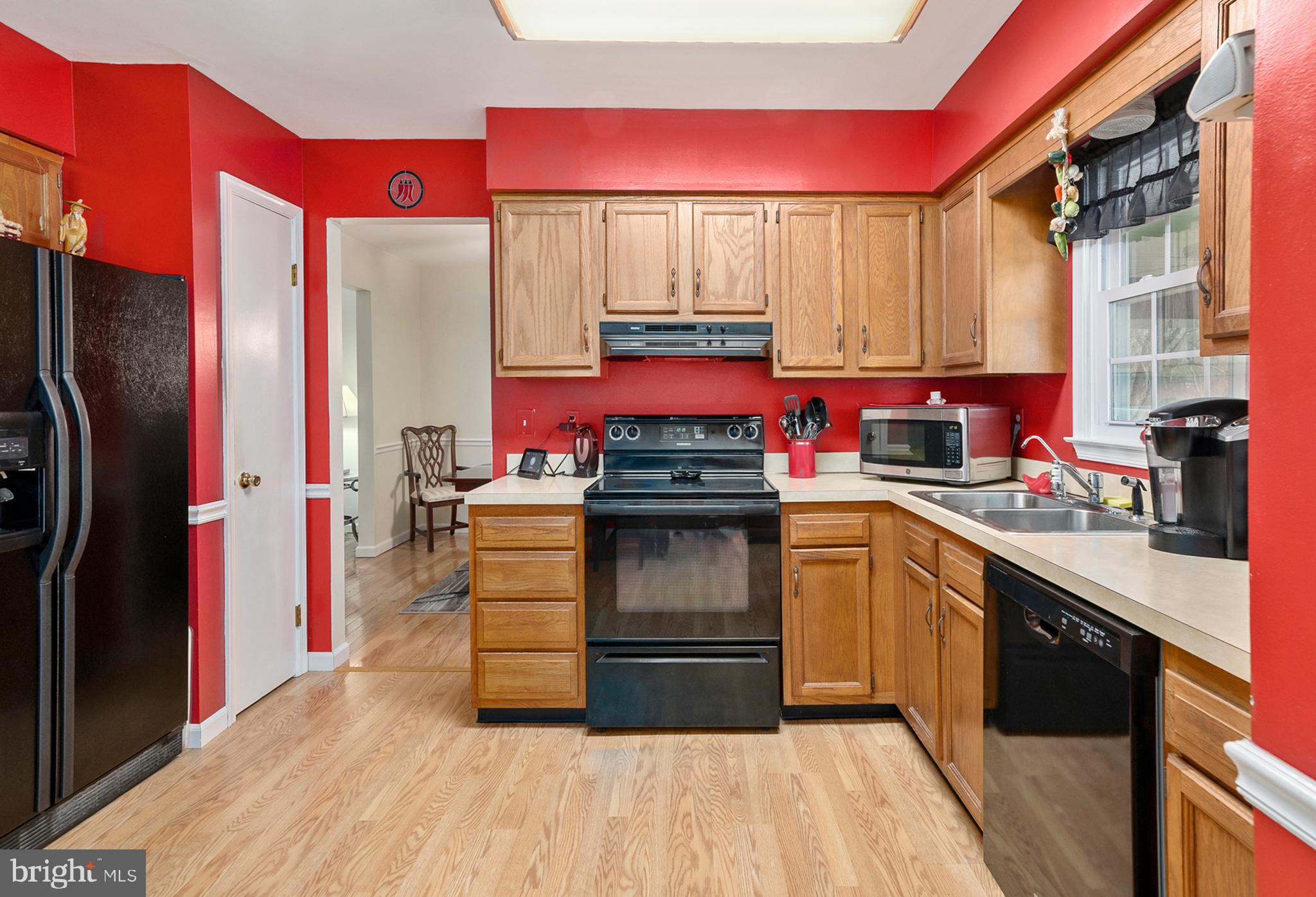 754 Oldfield Point Road Elkton, MD 21921 - Photo 19 of 49 a kitchen with stainless steel appliances a stove top oven and a refrigerator