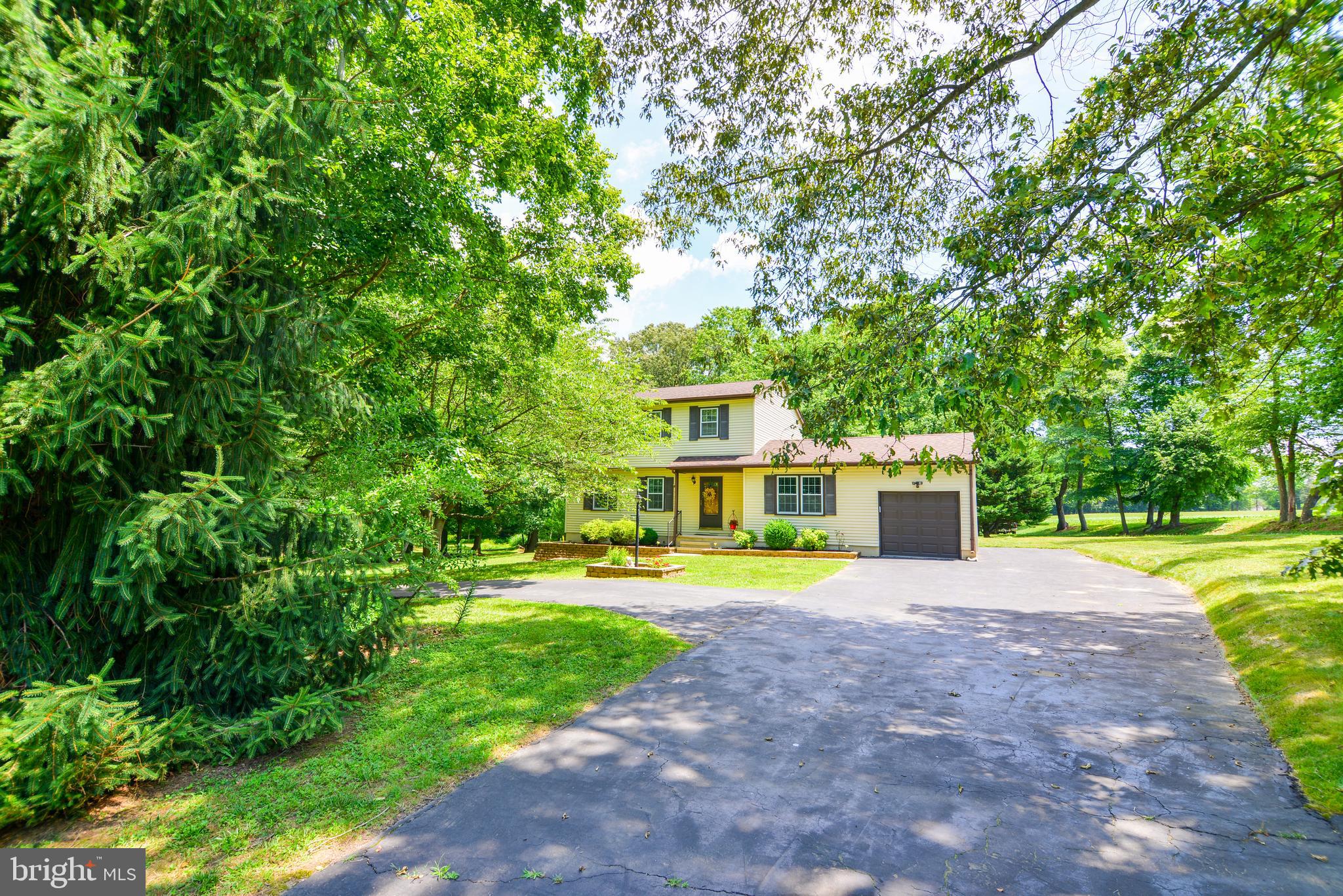754 Oldfield Point Road Elkton, MD 21921 - Photo 3 of 49 a front view of a house with a yard and trees