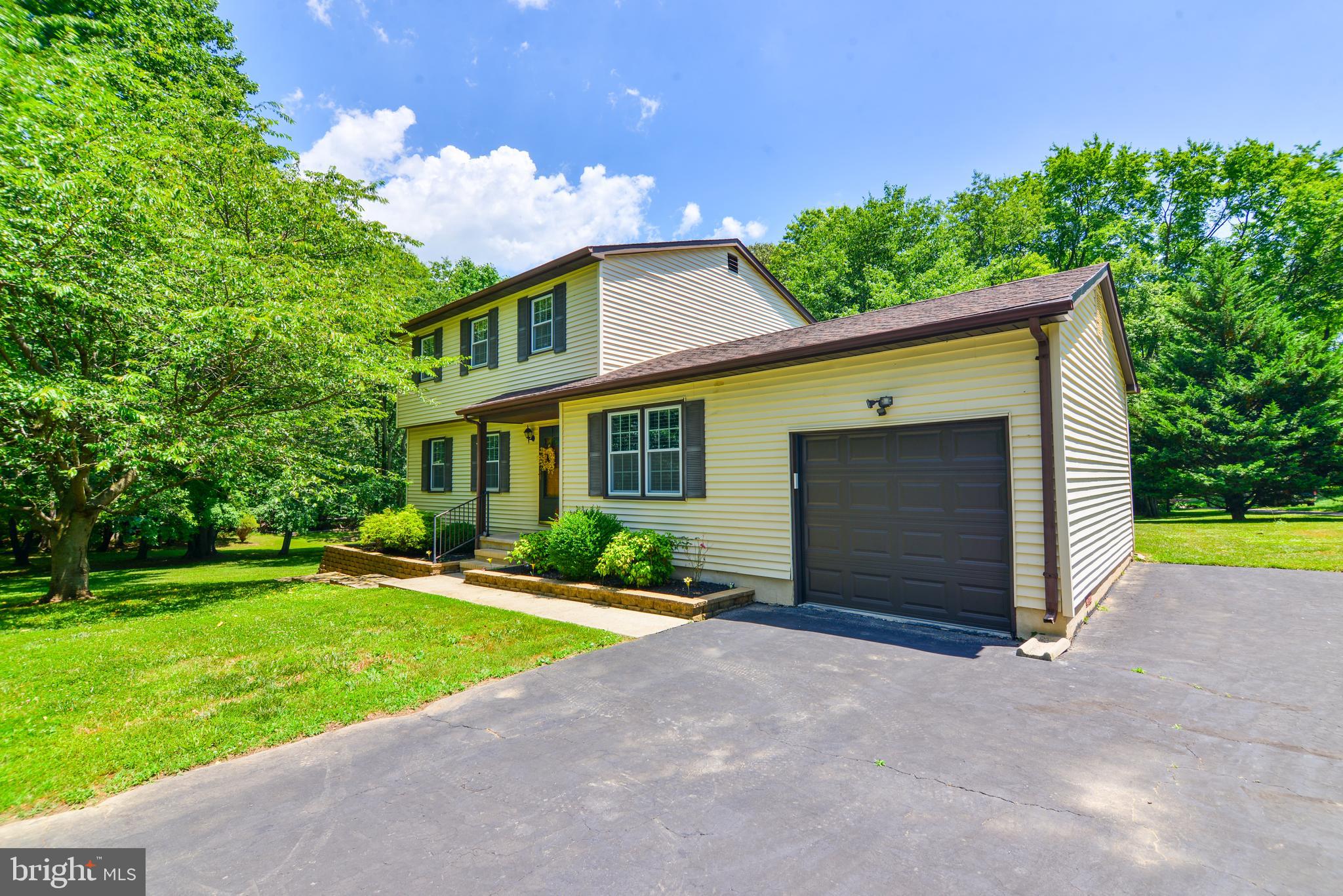 754 Oldfield Point Road Elkton, MD 21921 - Photo 4 of 49 a front view of a house with a yard and garage