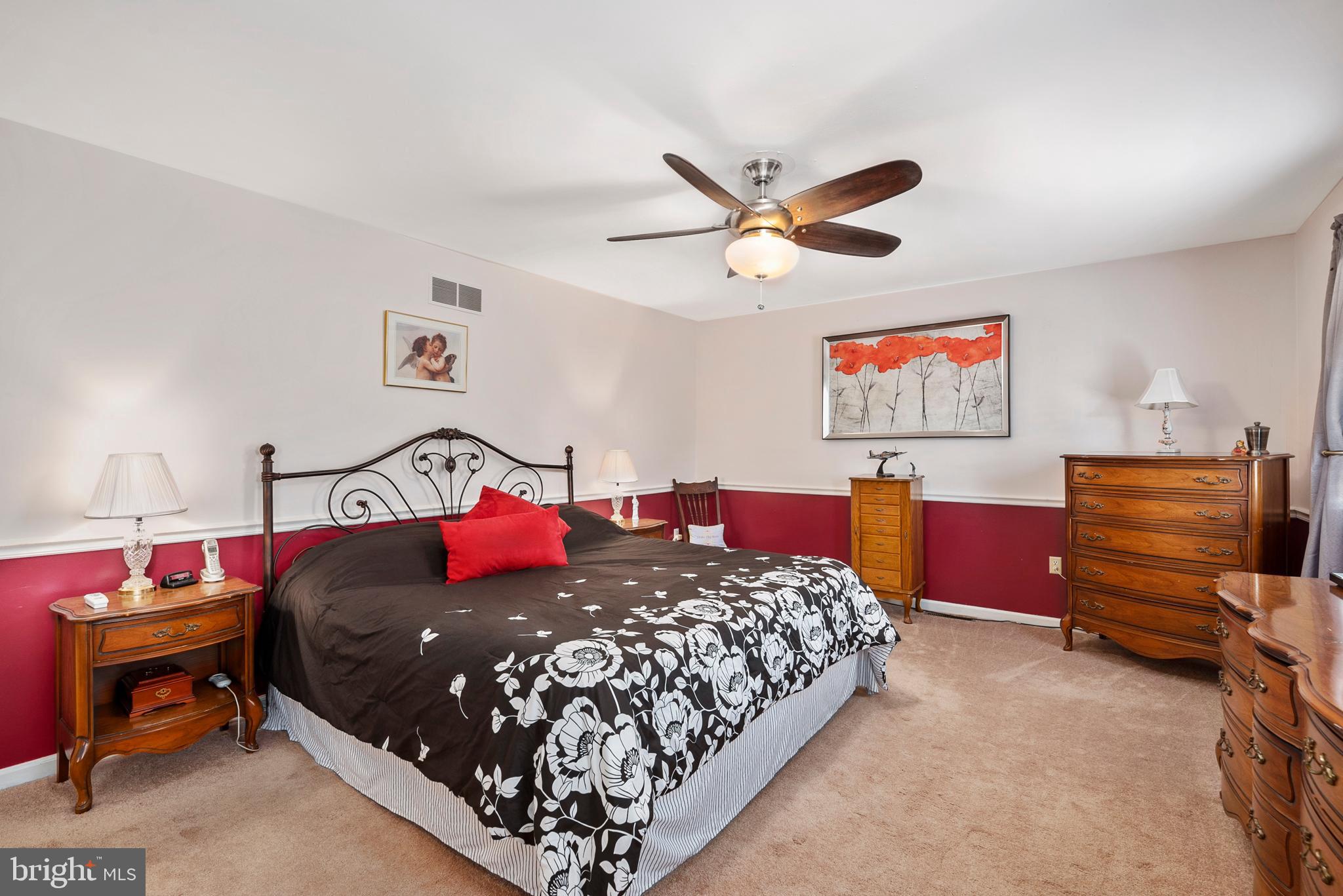 754 Oldfield Point Road Elkton, MD 21921 - Photo 39 of 49 a bedroom with a bed and dresser