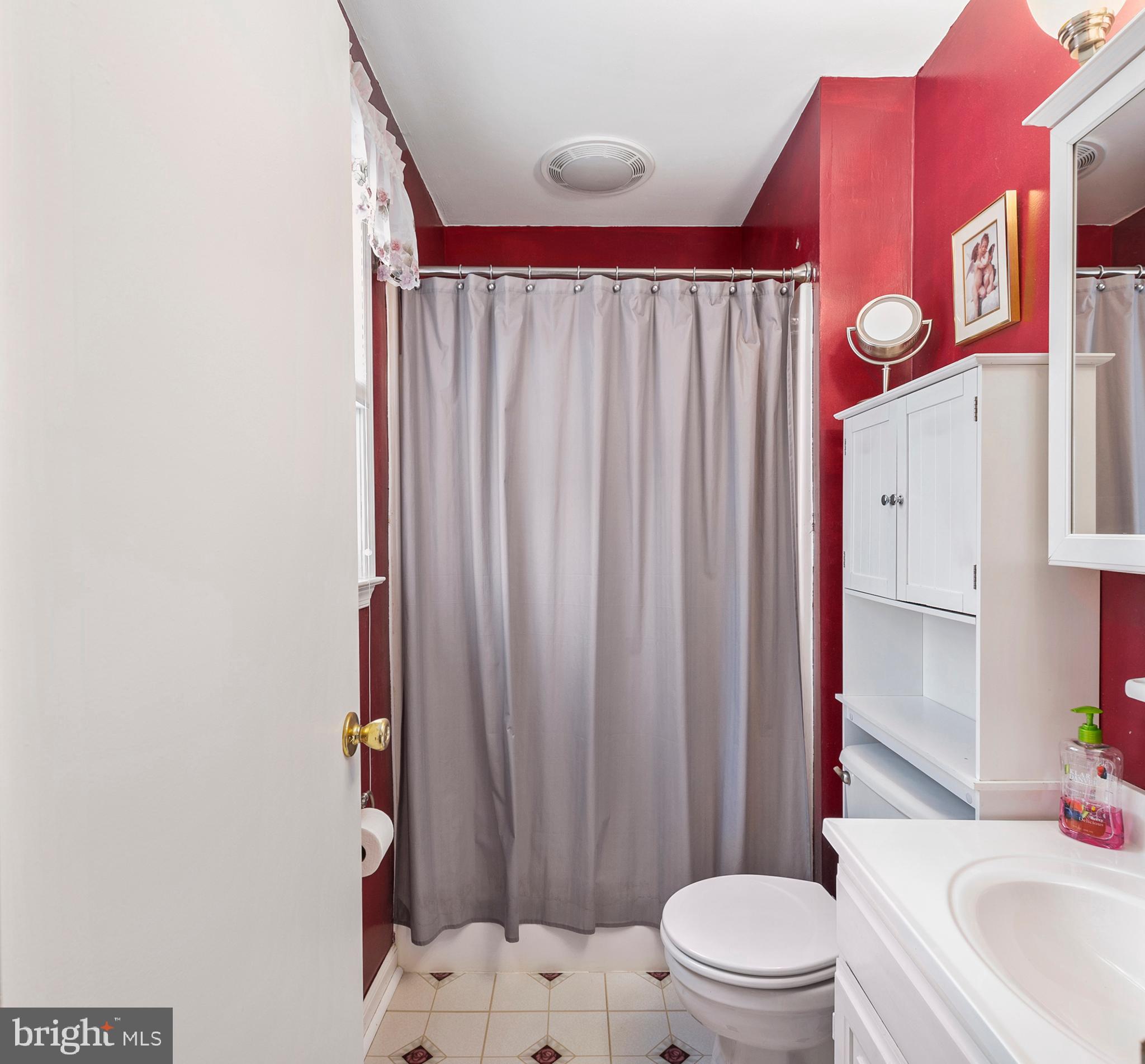 754 Oldfield Point Road Elkton, MD 21921 - Photo 40 of 49 a bathroom with a sink toilet and shower