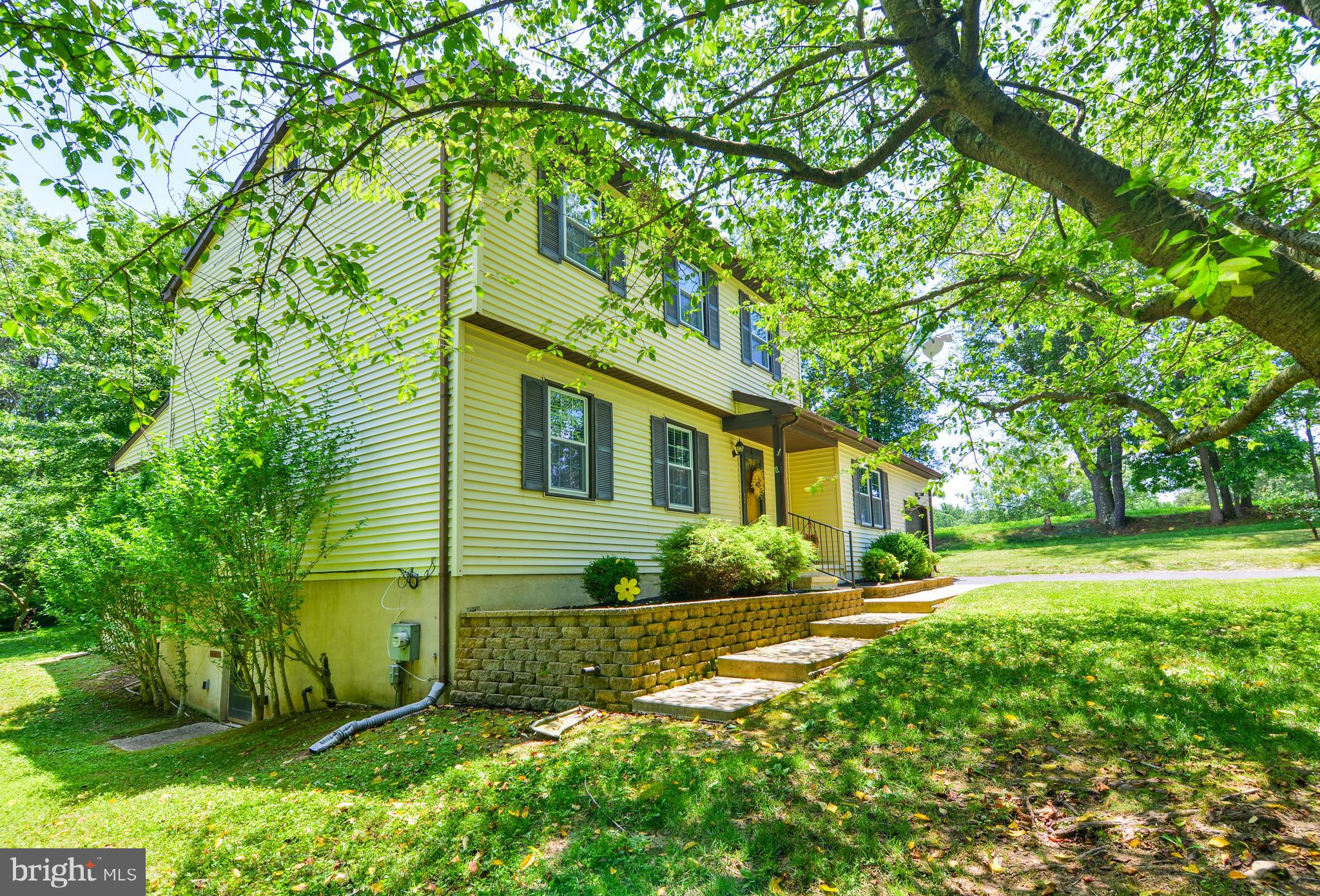 754 Oldfield Point Road Elkton, MD 21921 - Photo 5 of 49 a front view of a house with a yard