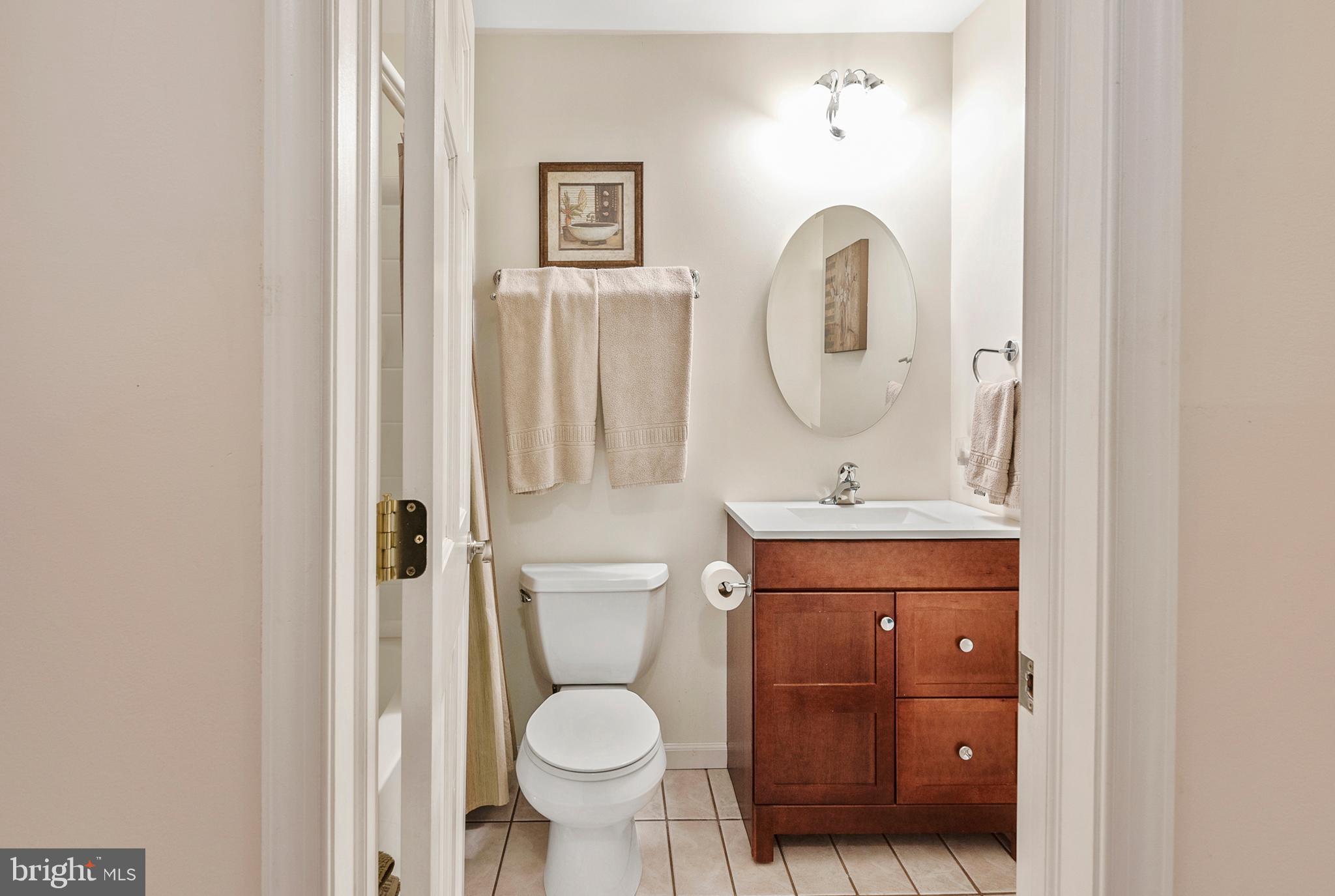 754 Oldfield Point Road Elkton, MD 21921 - Photo 42 of 49 a bathroom with a toilet sink and mirror