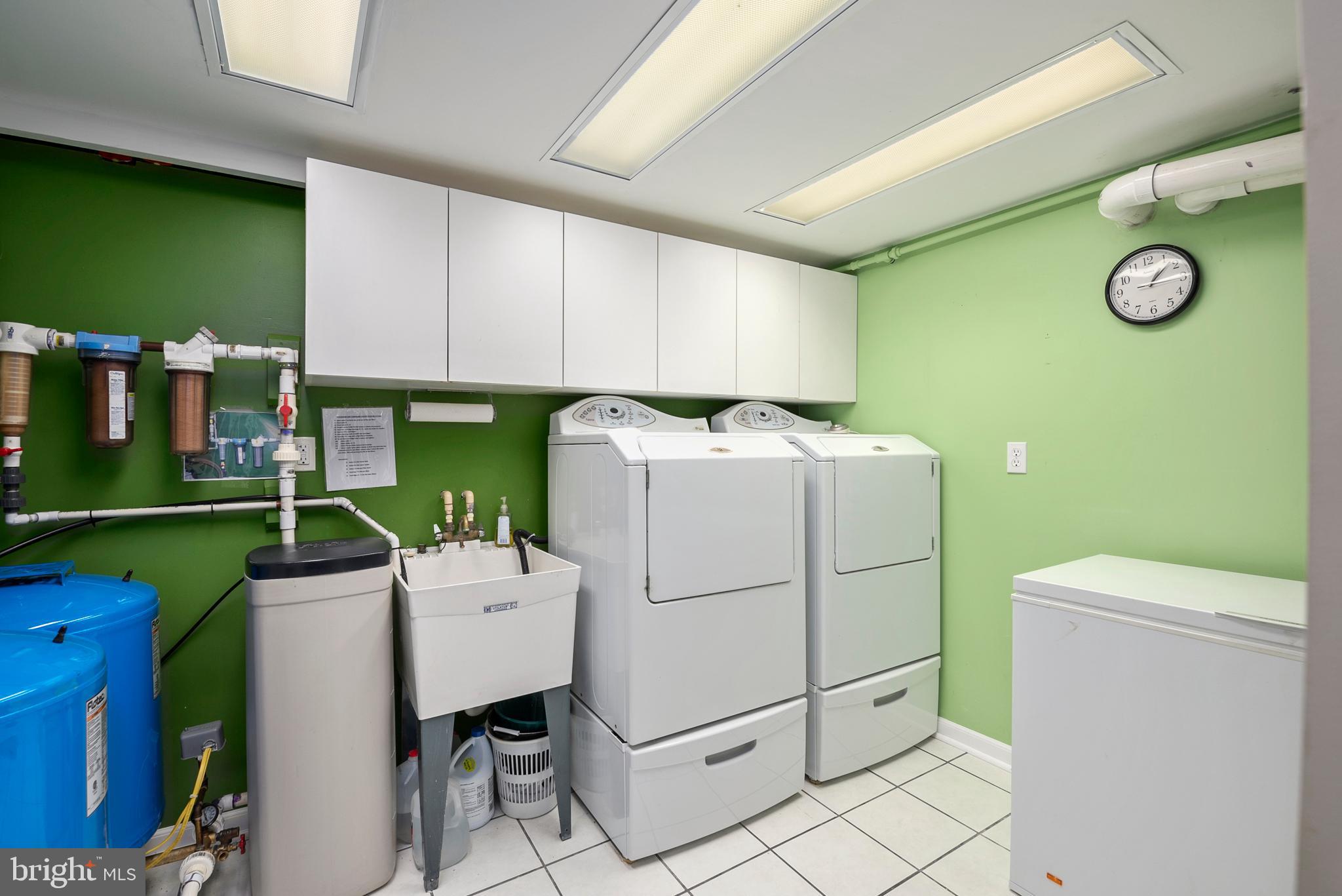 754 Oldfield Point Road Elkton, MD 21921 - Photo 44 of 49 a utility room with dryer and washer