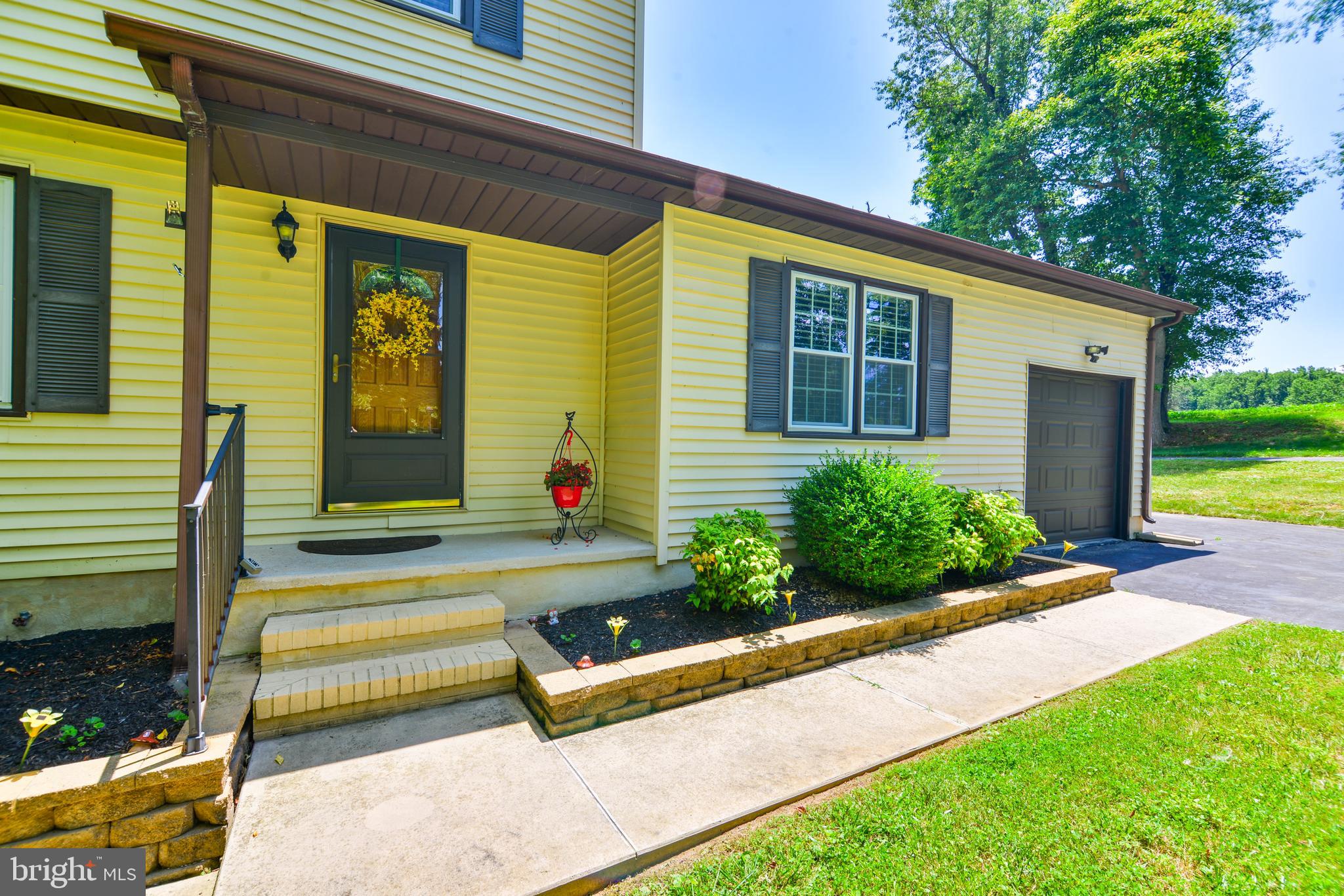 754 Oldfield Point Road Elkton, MD 21921 - Photo 6 of 49 a front view of a house with a yard outdoor seating and barbeque oven