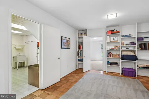 a bedroom with a bed and closet