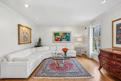 a living room with furniture and a rug