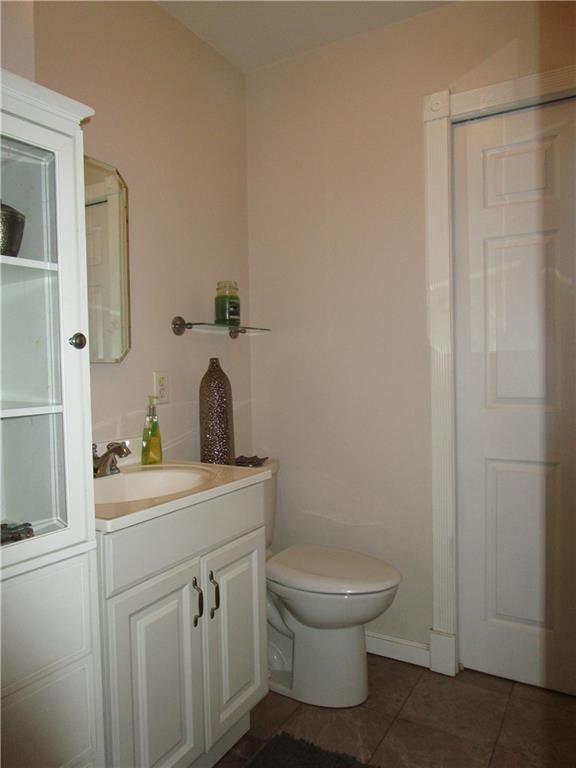 107 Fairview Avenue McKees Rocks, PA 15136 - Photo 12 of 24 Door in powder room leads to the laundry room