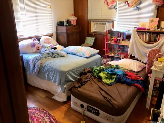 a bedroom with a bed and dresser
