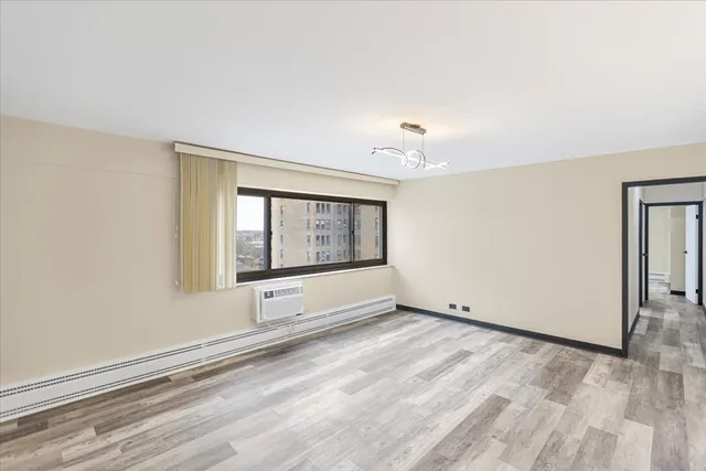 a view of an empty room with a window