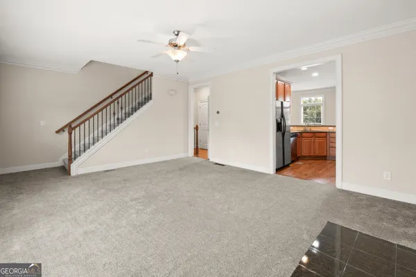 a view of a livingroom with a staircase