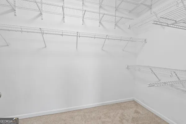 an empty room with shelves