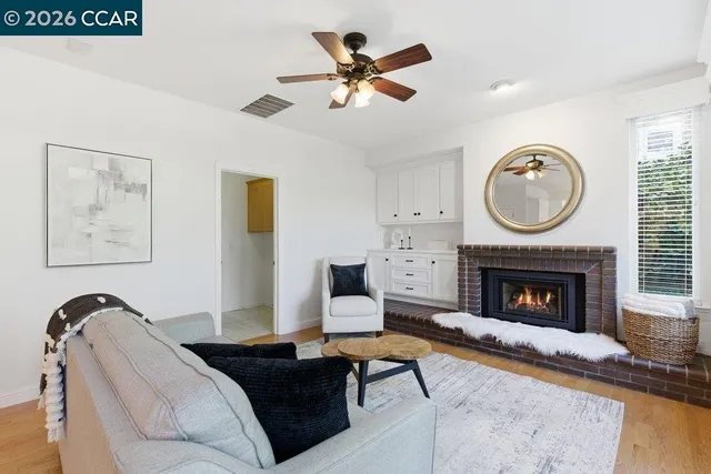 a living room with furniture and a fireplace
