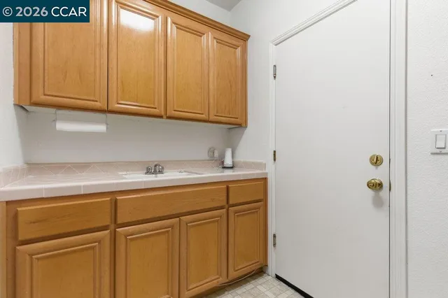 a bathroom with a sink and cabinets