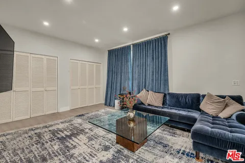 a living room with furniture and a couch