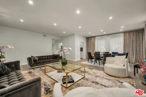 a living room with furniture and a table