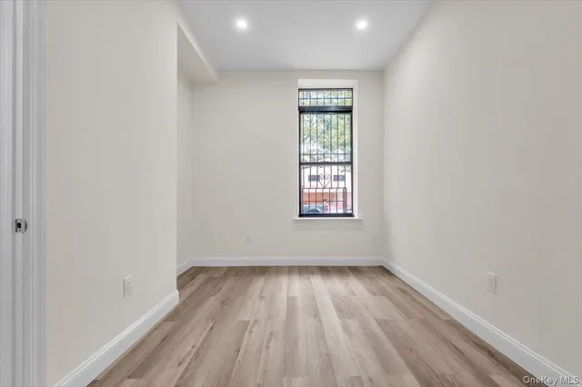 a view of an empty room and a window