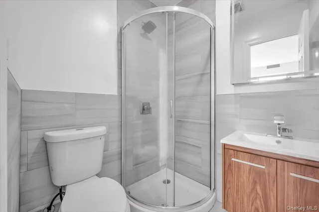 a bathroom with a toilet sink and shower