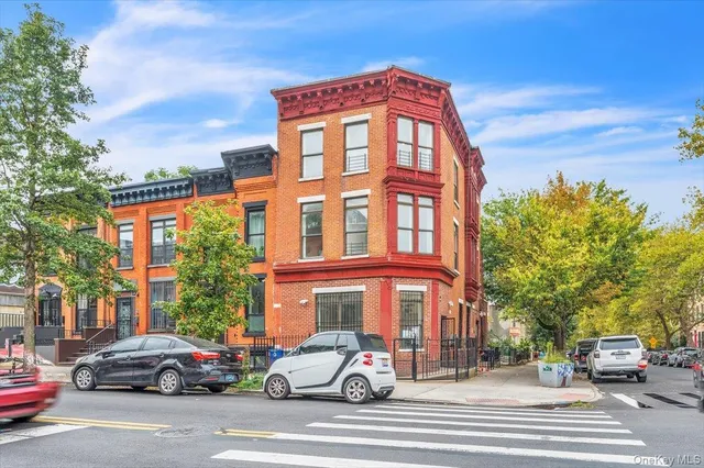 a tall building sitting on the side of a street