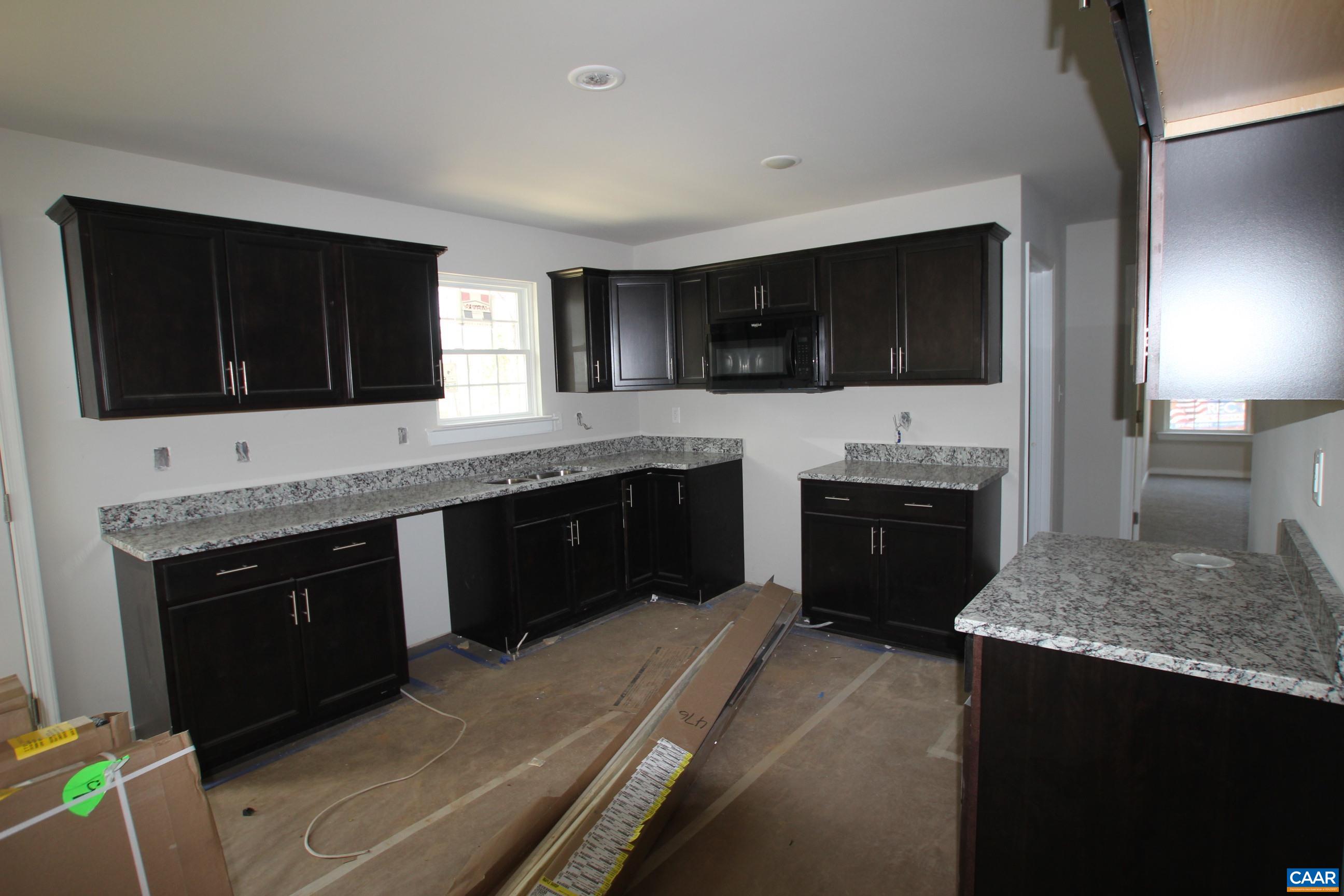 562 Pasture Lane Ruckersville, VA 22968 - Photo 8 of 37 a kitchen with a stove and a sink