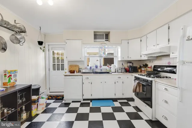 a kitchen with stainless steel appliances and cabinets