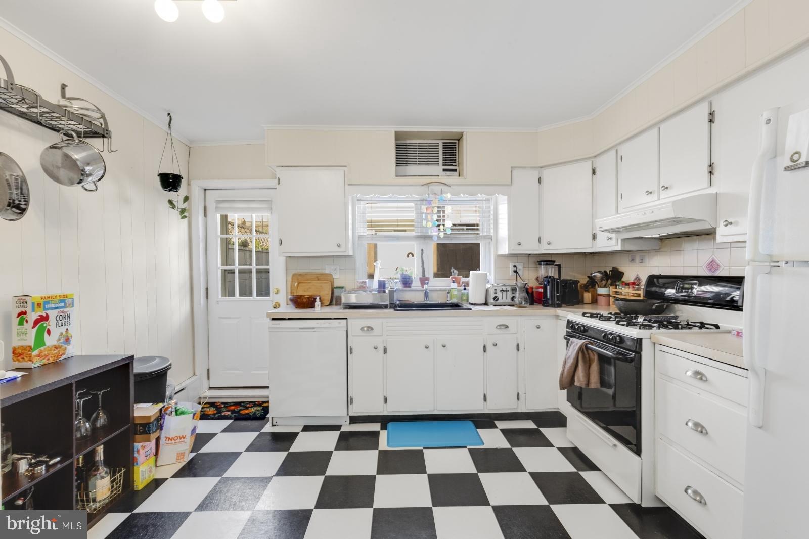 a kitchen with stainless steel appliances and cabinets