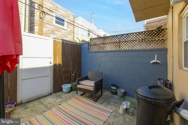 a bathroom with a sink a toilet and a rug