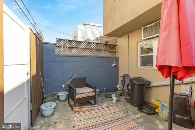a bathroom with a toilet a sink and a mirror