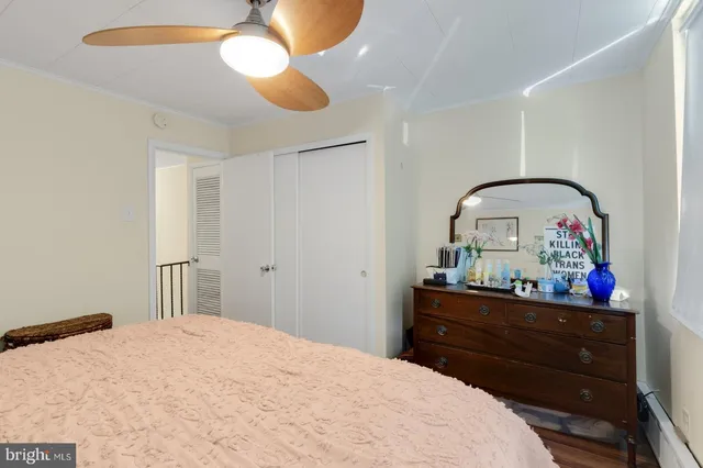 a bedroom with a bed and a dresser