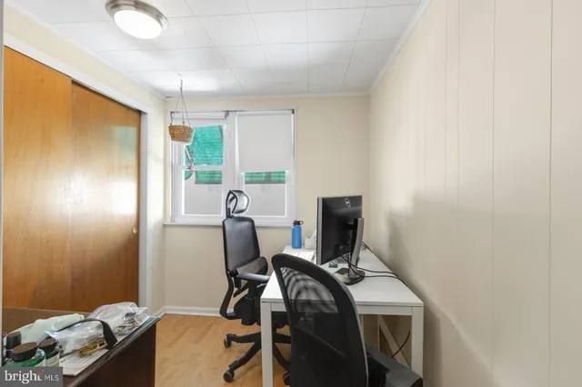 a view of workspace with furniture and window