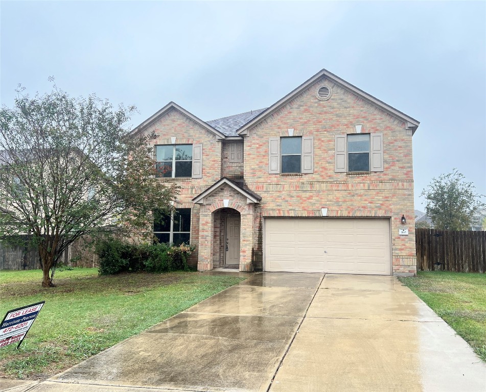 160 Mistletoe Lane Kyle, TX 78640 - Photo 1 of 1 a front view of a house with a yard and trees