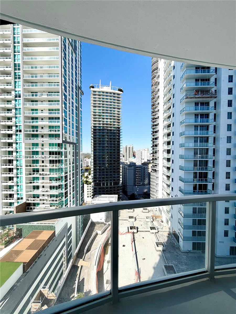 1060 Brickell Avenue, Unit 2113 Miami, FL 33131 - Photo 19 of 52 a view of a balcony with a large window