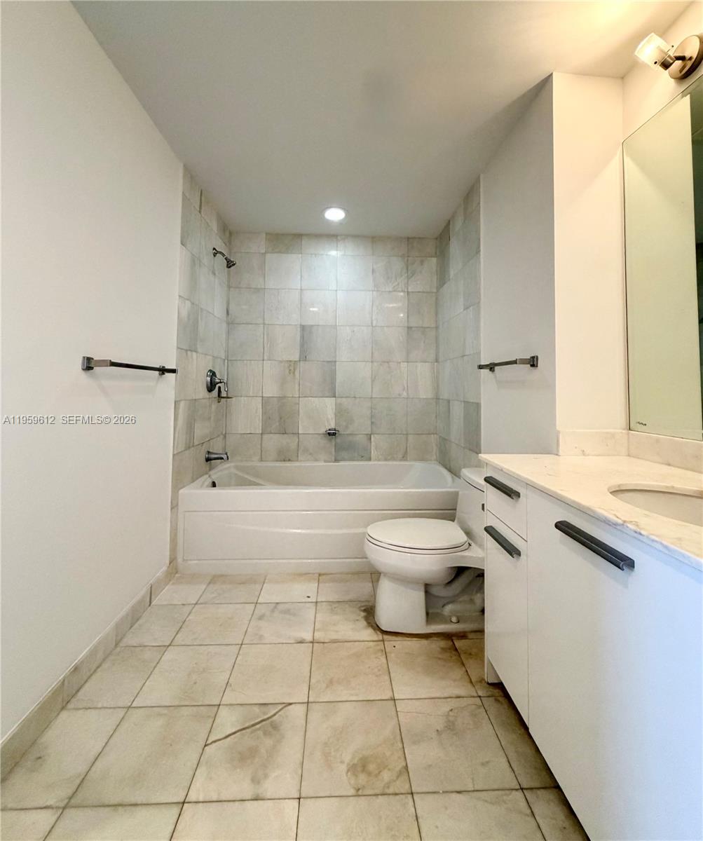1060 Brickell Avenue, Unit 2113 Miami, FL 33131 - Photo 23 of 52 a bathroom with a sink a toilet and shower