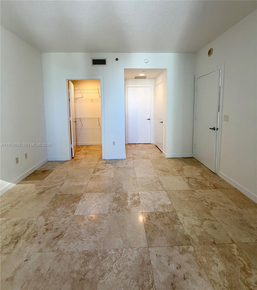 1060 Brickell Avenue, Unit 2113 Miami, FL 33131 - Photo 26 of 52 an empty room with windows