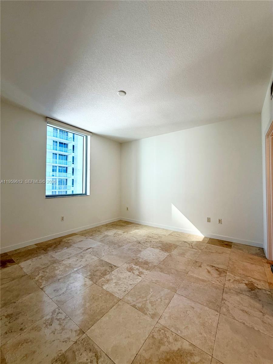 1060 Brickell Avenue, Unit 2113 Miami, FL 33131 - Photo 29 of 52 an empty room with windows
