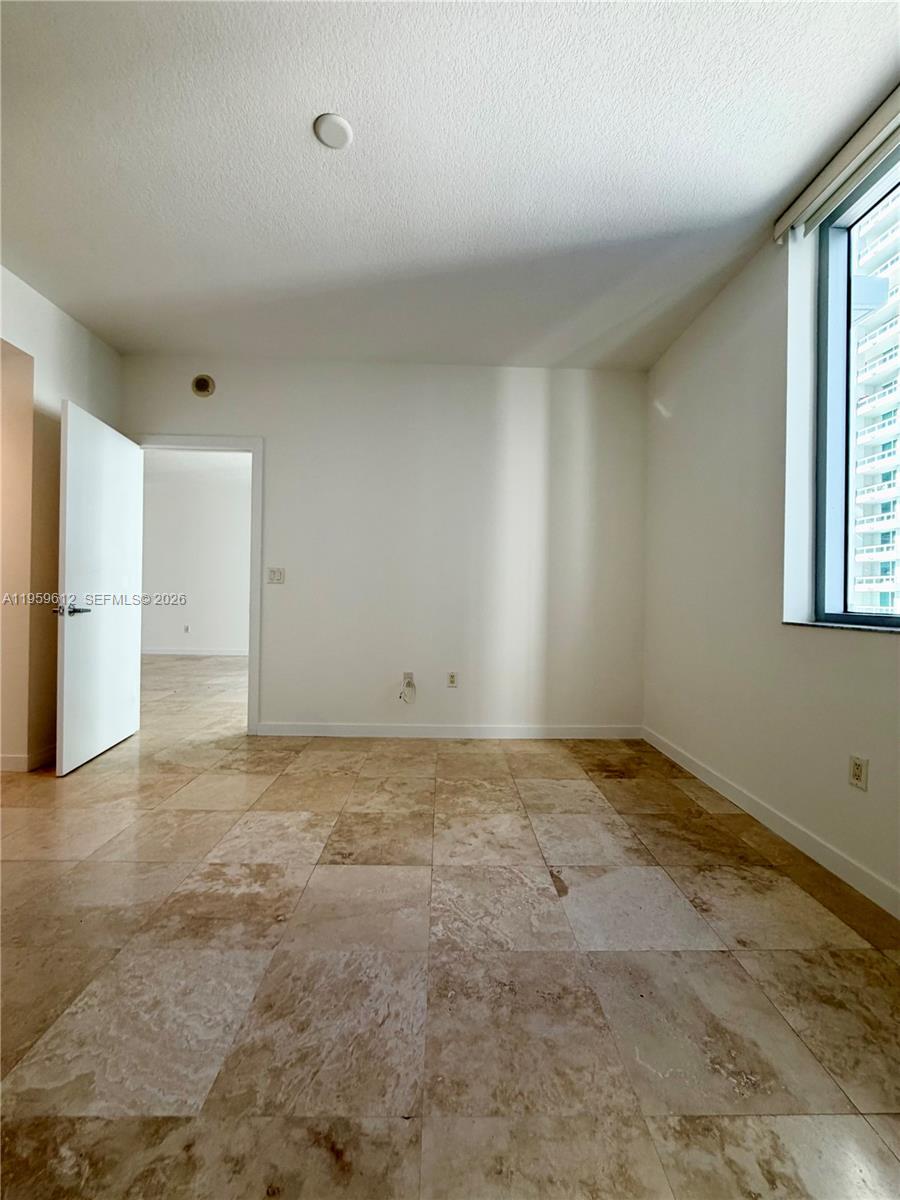 1060 Brickell Avenue, Unit 2113 Miami, FL 33131 - Photo 30 of 52 a view of an empty room with a window