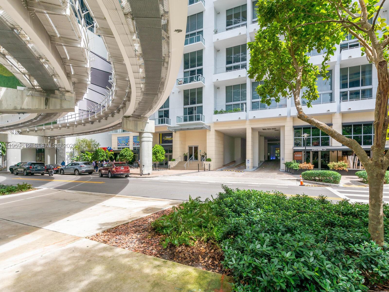 1060 Brickell Avenue, Unit 2113 Miami, FL 33131 - Photo 40 of 52 front view of a building with a garden