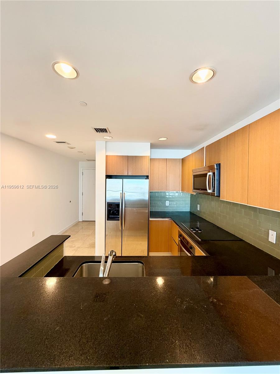 1060 Brickell Avenue, Unit 2113 Miami, FL 33131 - Photo 6 of 52 a view of a room with lots of windows