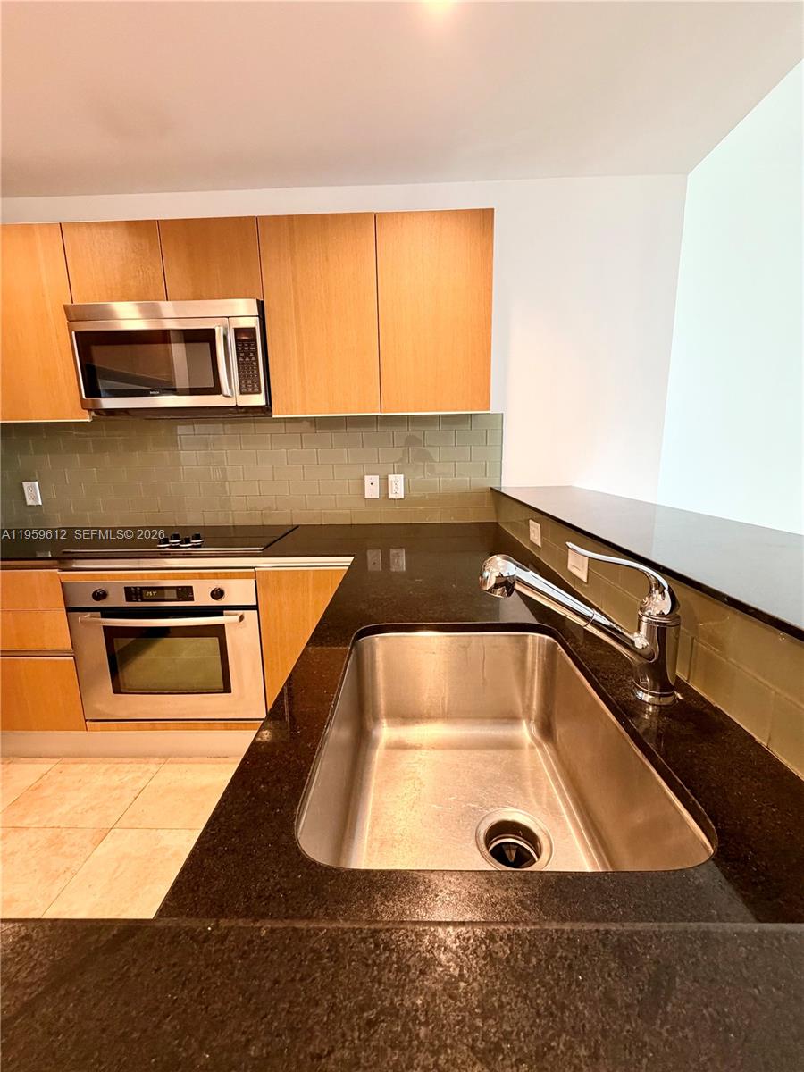 1060 Brickell Avenue, Unit 2113 Miami, FL 33131 - Photo 8 of 52 a view of a kitchen counter top space
