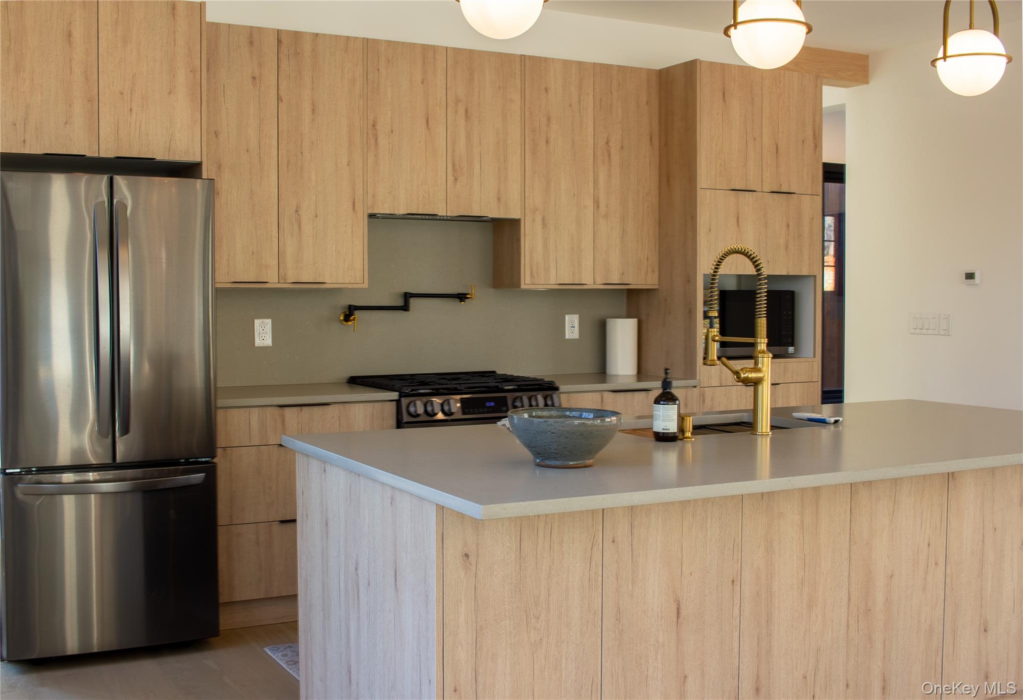 490 Old State Route 82 Craryville, NY 12521 - Photo 12 of 32 a kitchen with stainless steel appliances a refrigerator sink and stove