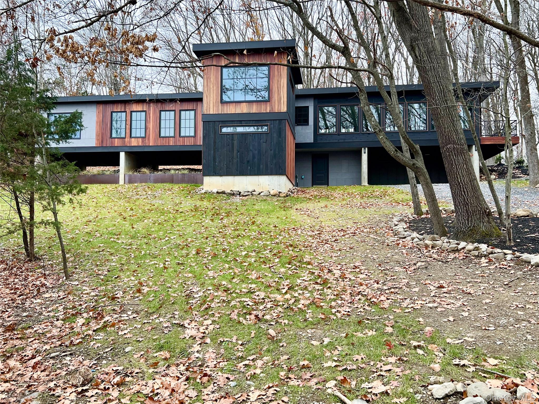 490 Old State Route 82 Craryville, NY 12521 - Photo 28 of 32 a front view of a building with a garden
