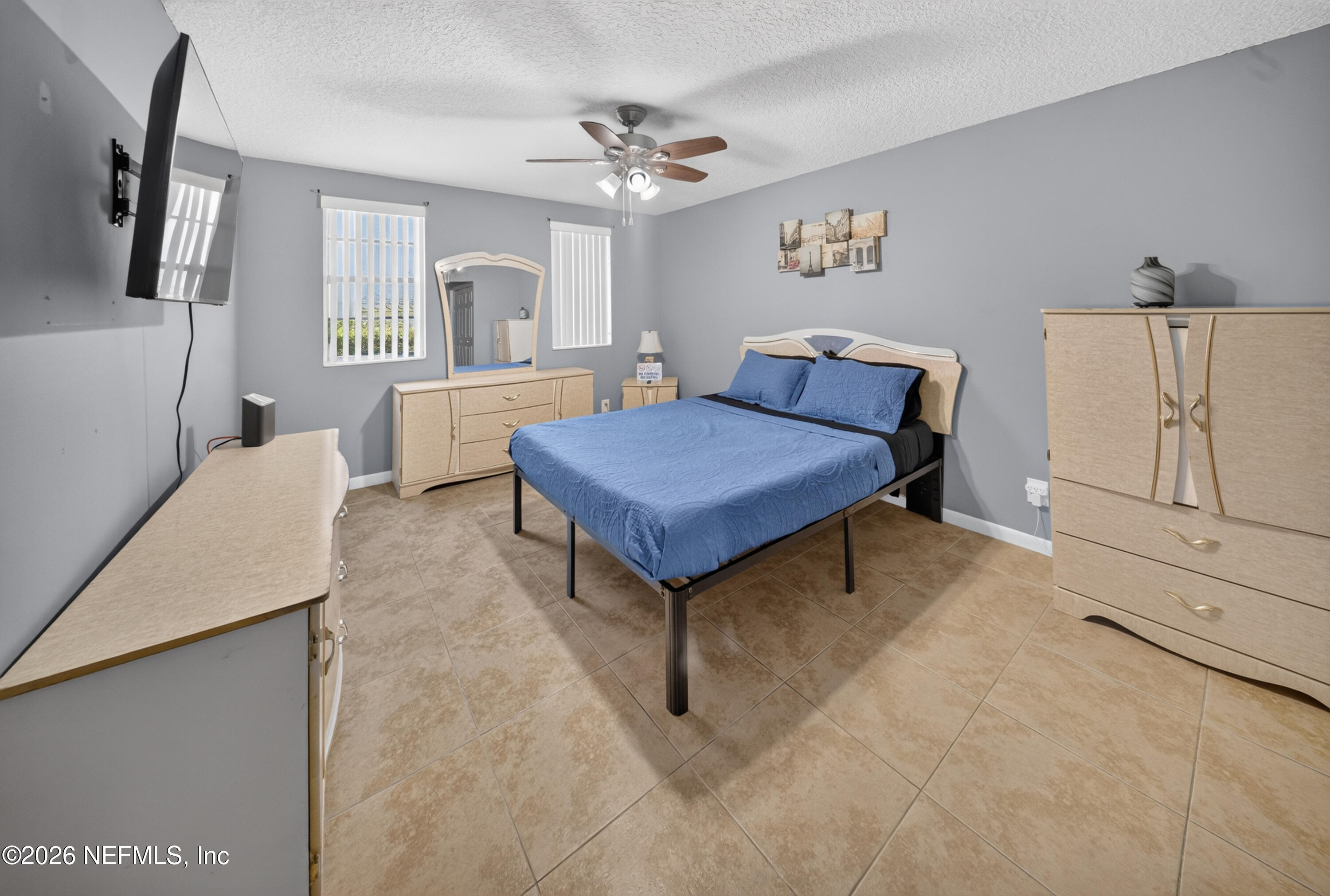 7346 El Barco Road, Unit 4 Jacksonville, FL 32216 - Photo 9 of 19 a bedroom with furniture and window