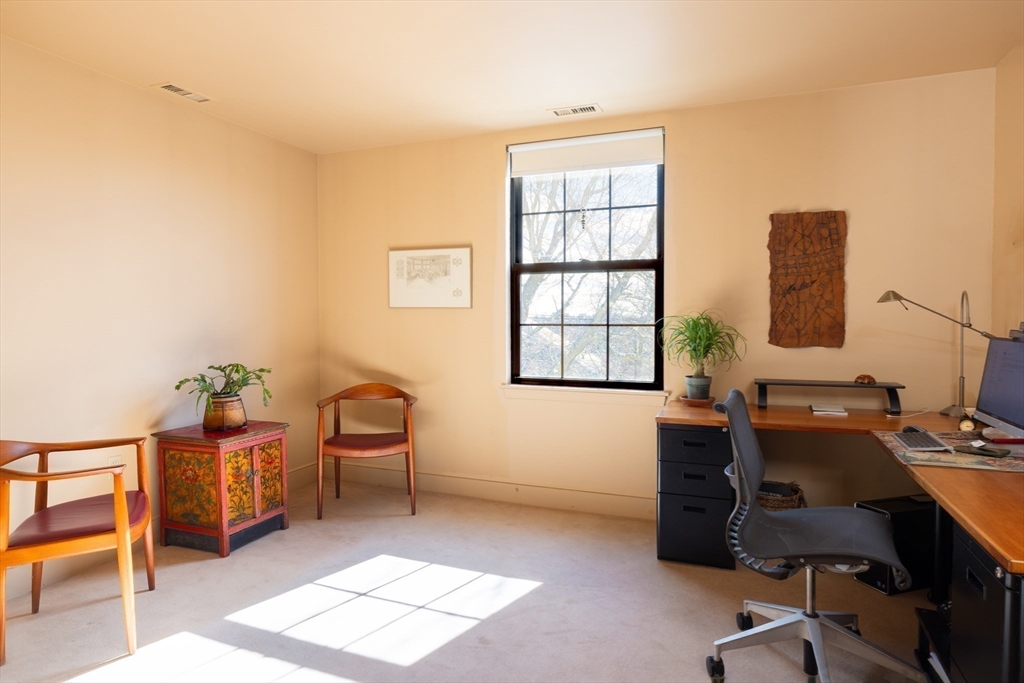 227 Summit Avenue, Unit E405 Brookline, MA 02446 - Photo 12 of 15 a view of a workspace with furniture and a window