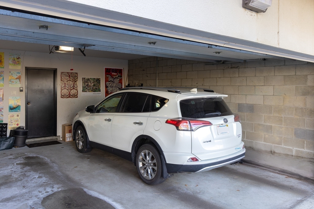 227 Summit Avenue, Unit E405 Brookline, MA 02446 - Photo 15 of 15 a car parked in garage
