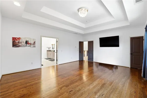 a view of a livingroom with wooden floor