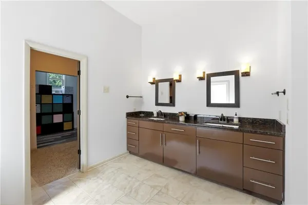 a kitchen with stainless steel appliances granite countertop a sink and cabinets