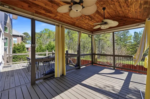 a view of a balcony with wooden floor
