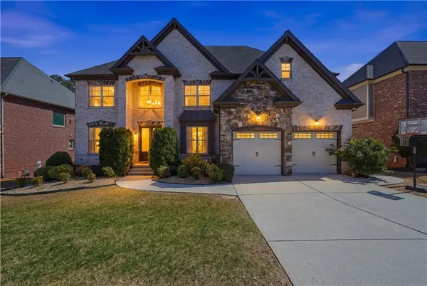 a front view of a house with garden