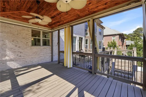 a view of a balcony with wooden floor